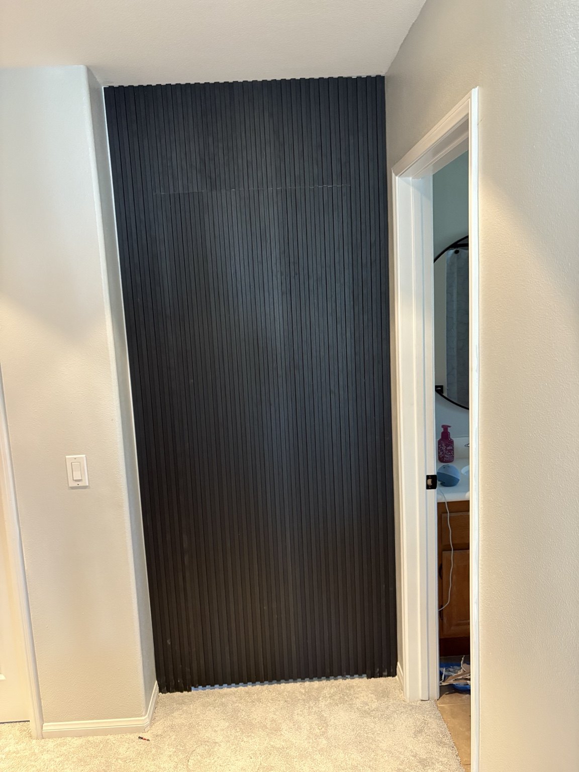 Hidden Door & Slat Accent Wall after